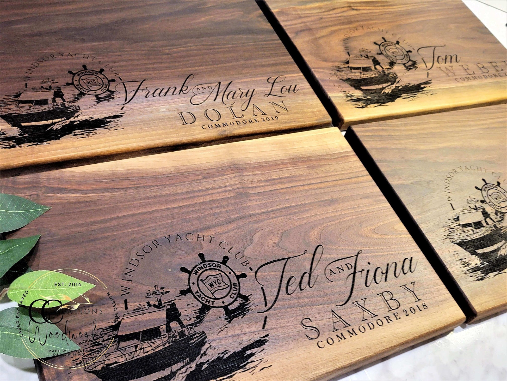 Customized engraved wooden cutting boards by CCW featuring nautical designs and personalized names. Handcrafted expert craftsmanship.